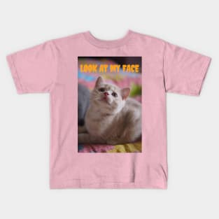 the cats want you to look at her face Kids T-Shirt